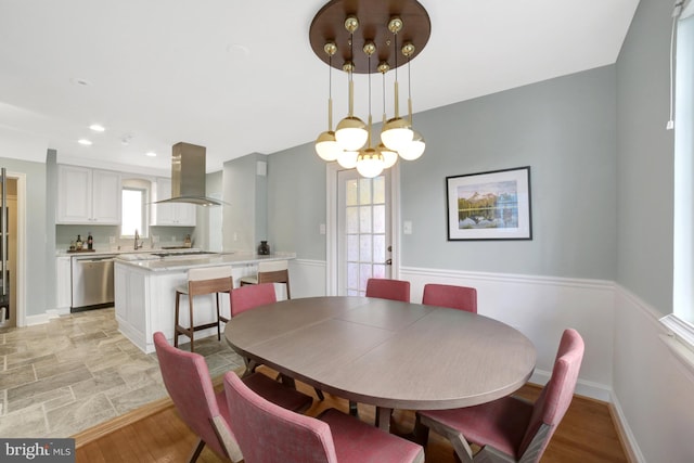 dining room featuring baseboards and recessed lighting