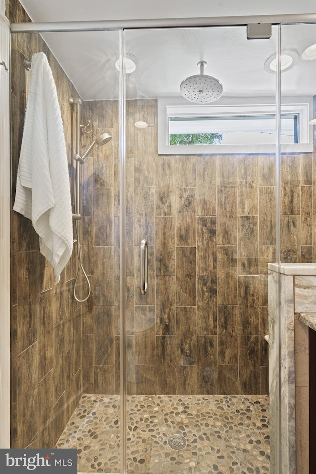 full bathroom featuring a shower stall