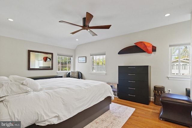 bedroom featuring lofted ceiling, a ceiling fan, recessed lighting, and light wood-style floors