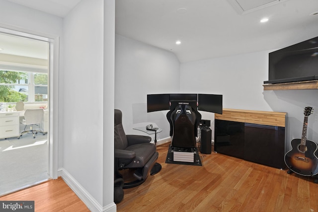 home office featuring baseboards, wood finished floors, and recessed lighting