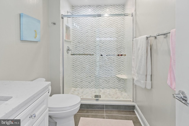 full bathroom featuring vanity, tile patterned flooring, a shower stall, and toilet