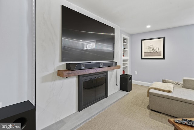 living room featuring recessed lighting, light carpet, built in features, and baseboards