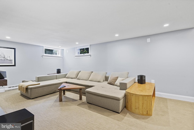 living room with a baseboard heating unit, baseboards, light colored carpet, and recessed lighting