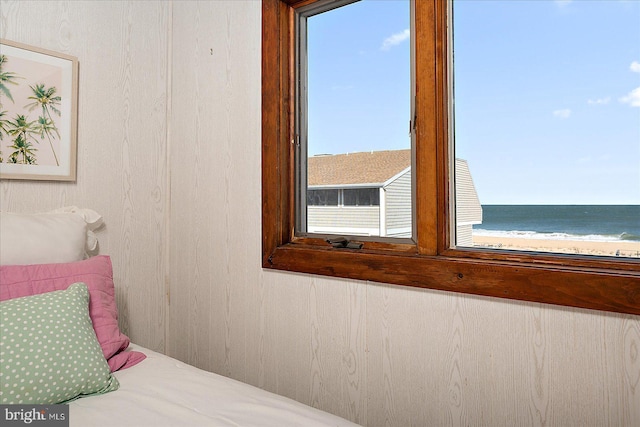 bedroom featuring a water view