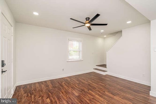empty room with a ceiling fan, wood finished floors, recessed lighting, and baseboards