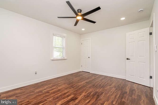 unfurnished room with ceiling fan, dark wood finished floors, baseboards, and recessed lighting