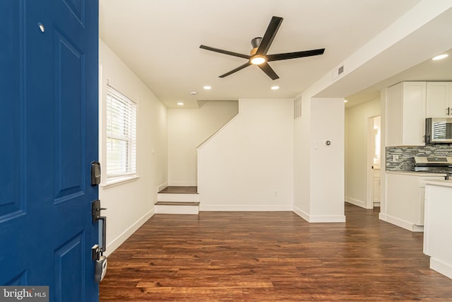 foyer entrance featuring ceiling fan, dark wood-type flooring, baseboards, and recessed lighting