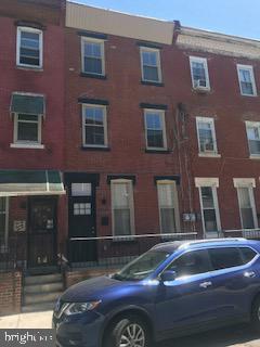 2025 N Woodstock St, Philadelphia, PA 19121 - view of front facade featuring brick siding