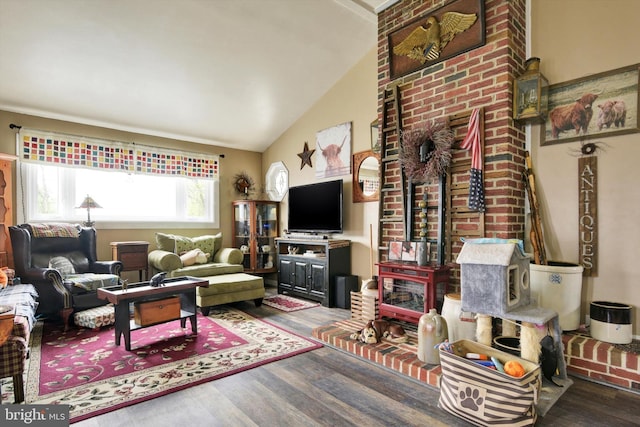 living room featuring wood finished floors and high vaulted ceiling