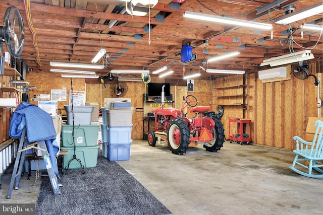 garage featuring a wall unit AC