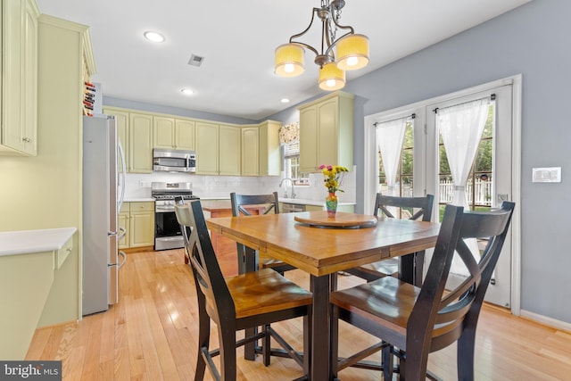 15008 Seneca Knoll Way, Haymarket, VA 20169 - dining area featuring recessed lighting, visible vents, a notable chandelier, and light wood-style floors