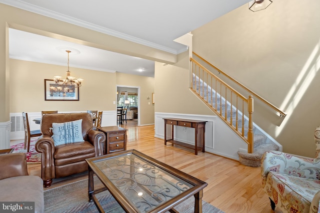 15008 Seneca Knoll Way, Haymarket, VA 20169 - living room with wood finished floors, a notable chandelier, and stairs