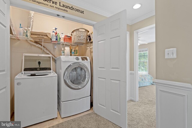 15008 Seneca Knoll Way, Haymarket, VA 20169 - clothes washing area featuring ornamental molding, washing machine and dryer, laundry area, and carpet floors
