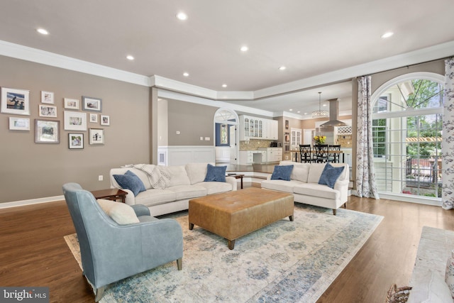 6601 Rutledge Dr, Fairfax Station, VA 22039 - living area featuring crown molding, recessed lighting, baseboards, and wood finished floors