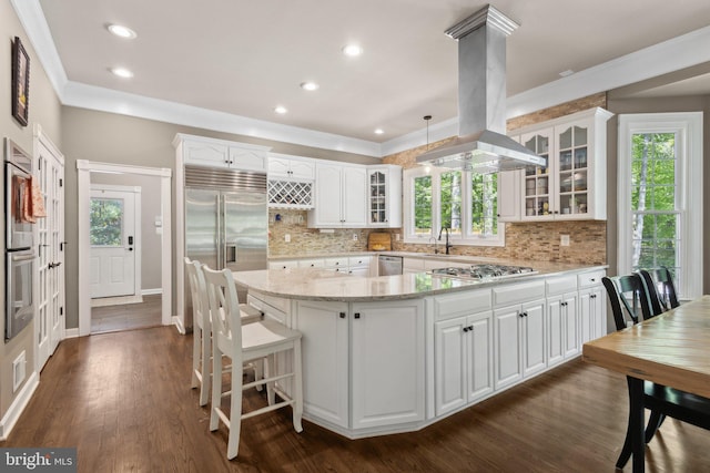 6601 Rutledge Dr, Fairfax Station, VA 22039 - kitchen with appliances with stainless steel finishes, plenty of natural light, and island range hood