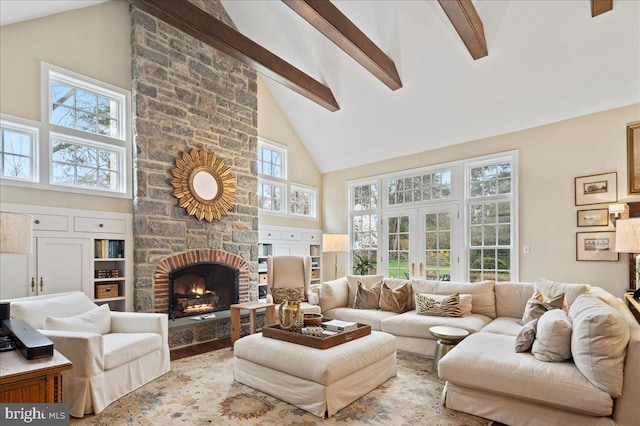 living room featuring french doors, beam ceiling, high vaulted ceiling, and a fireplace