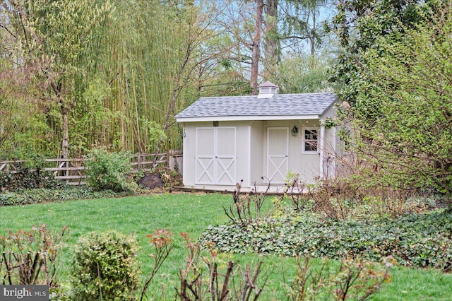 view of shed with fence