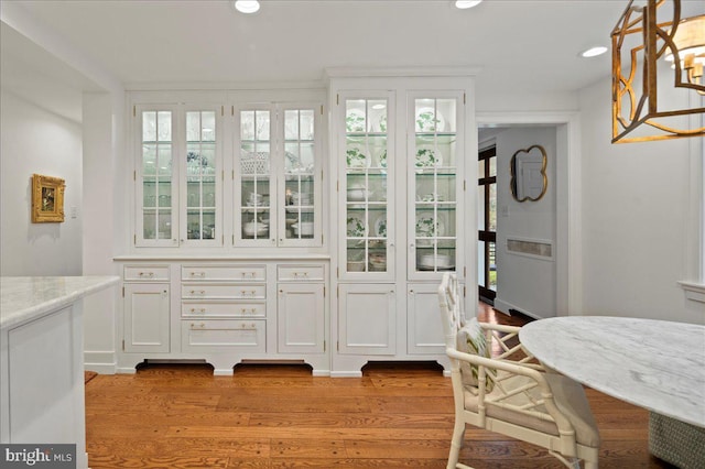 dining room featuring recessed lighting and light wood finished floors