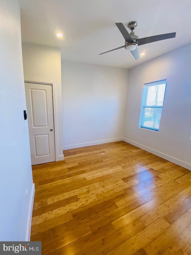 unfurnished room featuring light wood-type flooring, baseboards, ceiling fan, and recessed lighting
