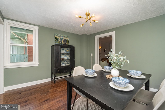 542 E Orange St, Lancaster, PA 17602 - dining room with baseboards, a notable chandelier, wood finished floors, and a textured ceiling