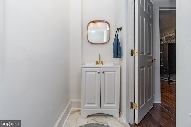 542 E Orange St, Lancaster, PA 17602 - bathroom featuring baseboards, vanity, and wood finished floors