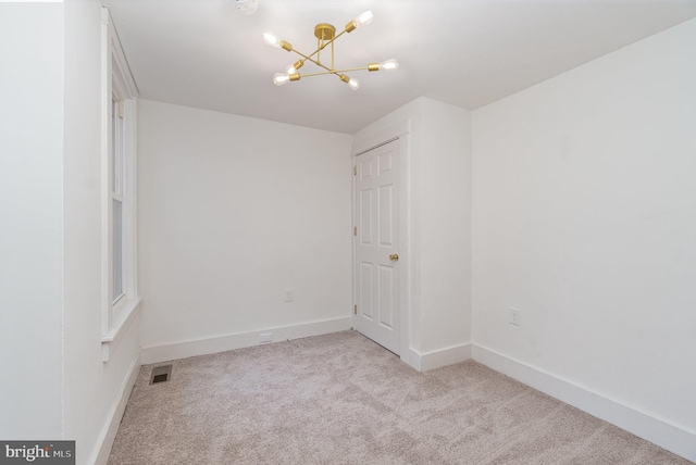 542 E Orange St, Lancaster, PA 17602 - empty room featuring baseboards, a notable chandelier, carpet, and visible vents