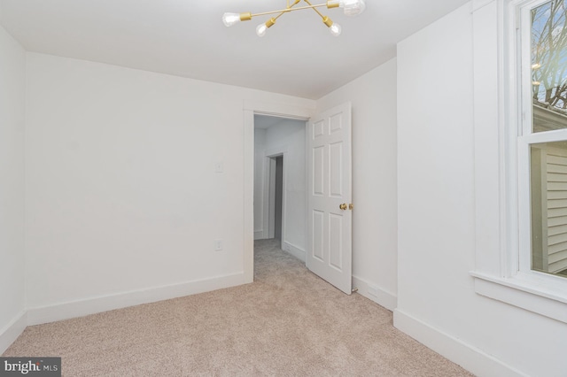 542 E Orange St, Lancaster, PA 17602 - carpeted spare room with an inviting chandelier and baseboards