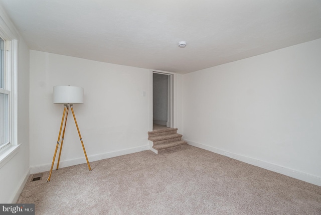 542 E Orange St, Lancaster, PA 17602 - spare room with stairs, carpet flooring, visible vents, and baseboards