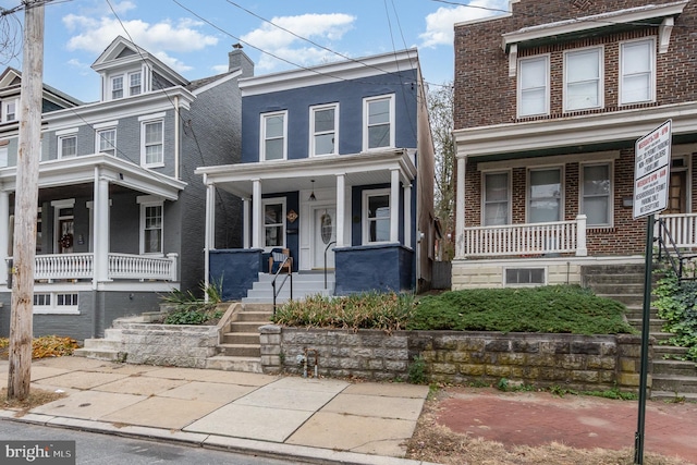 542 E Orange St, Lancaster, PA 17602 - view of front of house with a porch and brick siding