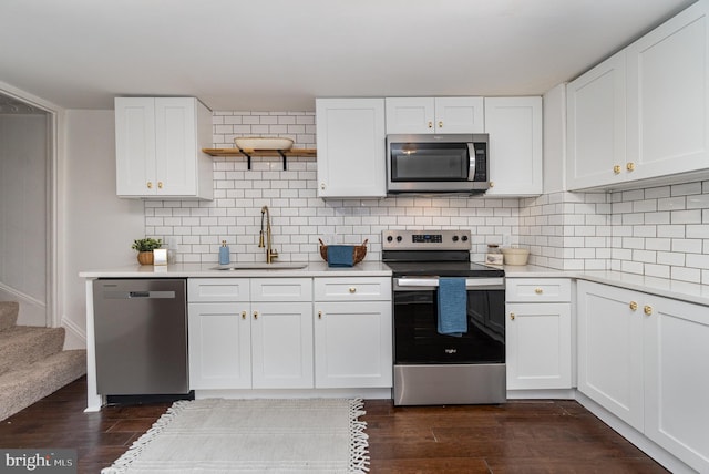 542 E Orange St, Lancaster, PA 17602 - kitchen with decorative backsplash, dark wood-style flooring, a sink, and stainless steel appliances