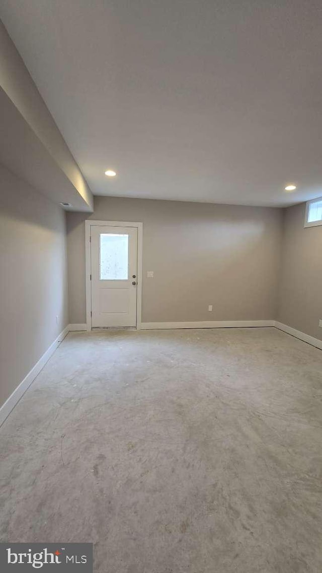 basement with baseboards and recessed lighting