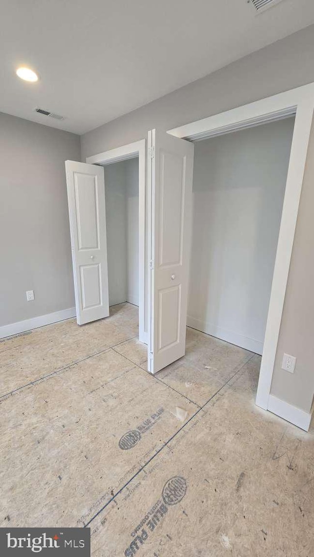 below grade area featuring baseboards and visible vents