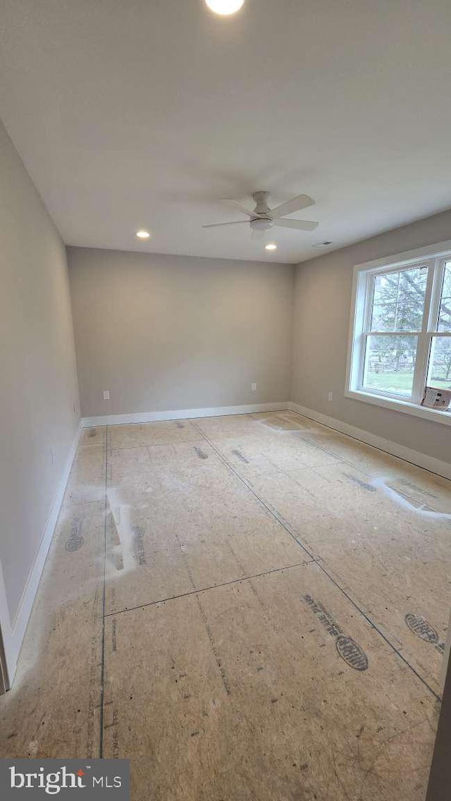 spare room featuring ceiling fan, baseboards, and recessed lighting