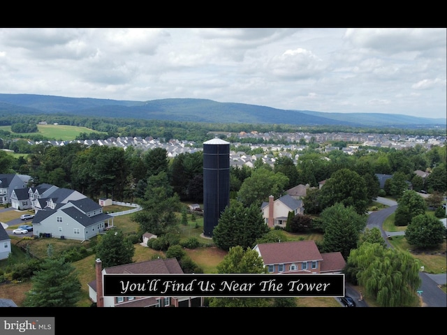 bird's eye view featuring a residential view and a mountain view