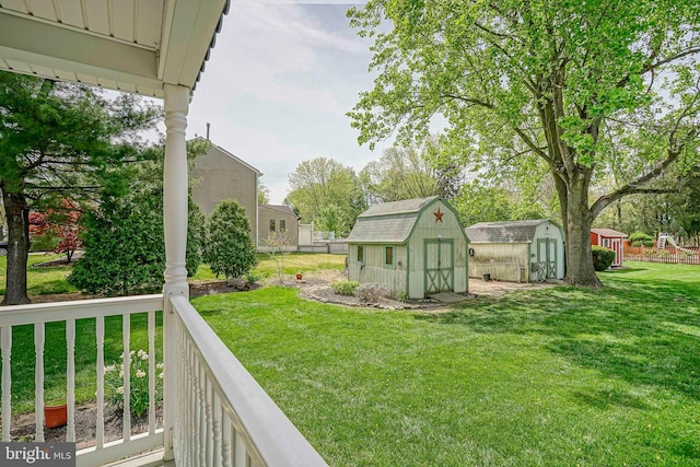 view of yard with a storage shed and an outdoor structure