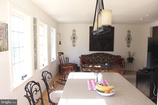 dining area with recessed lighting, wood finished floors, and baseboards