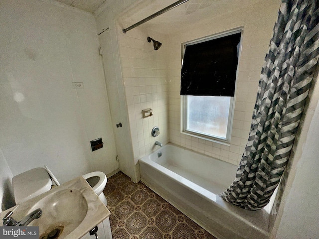 2214 Noble St, Reading, PA 19609 - bathroom featuring shower / bath combo with shower curtain, toilet, and vanity