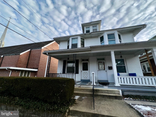 2214 Noble St, Reading, PA 19609 - view of front of home featuring brick siding and a porch