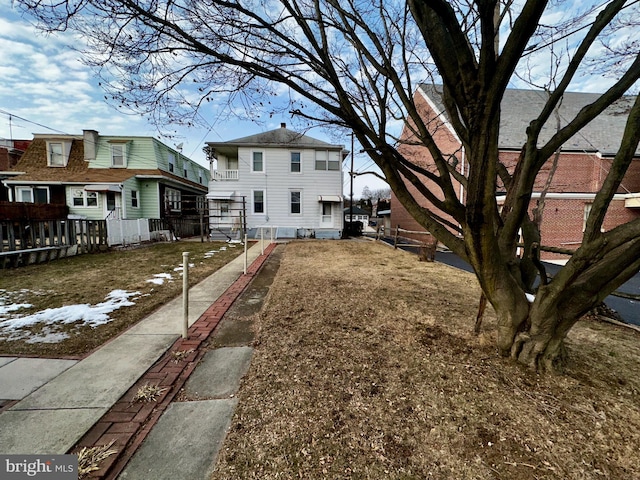 2214 Noble St, Reading, PA 19609 - rear view of property featuring a chimney