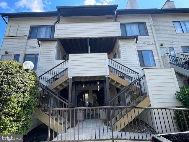 view of building exterior featuring stairs