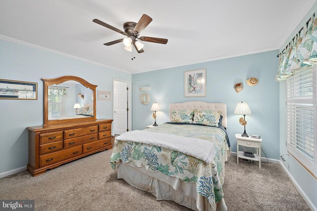 bedroom featuring crown molding, baseboards, ceiling fan, and carpet