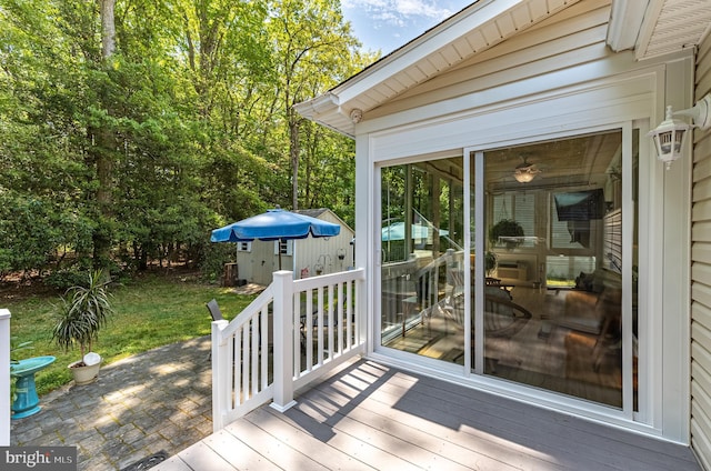 wooden terrace featuring a sunroom