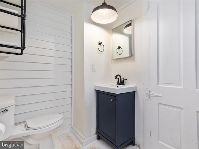 half bath with vanity and toilet