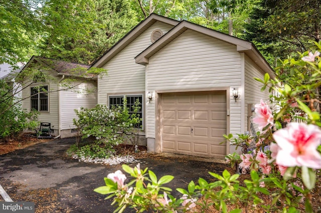 view of front of house featuring an attached garage and driveway