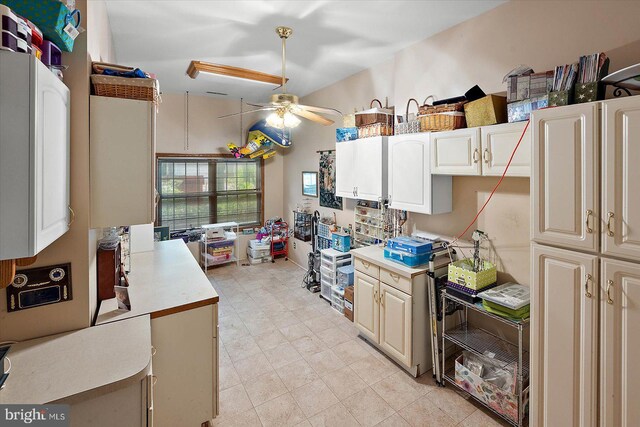 kitchen with a ceiling fan and light countertops