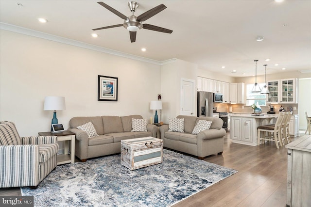 418 S Seaway Ct, Cambridge, MD 21613 - living area featuring ceiling fan, recessed lighting, wood finished floors, and crown molding