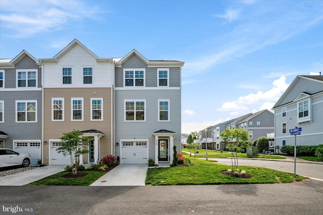418 S Seaway Ct, Cambridge, MD 21613 - townhome / multi-family property featuring a residential view, a garage, and concrete driveway