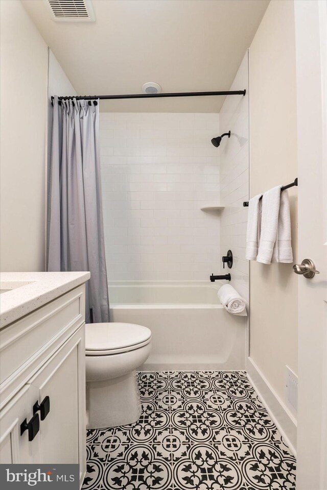 418 S Seaway Ct, Cambridge, MD 21613 - full bathroom with toilet, shower / bath combo with shower curtain, vanity, and tile patterned flooring