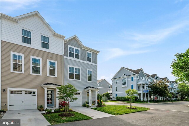 418 S Seaway Ct, Cambridge, MD 21613 - view of property featuring a residential view, a garage, and driveway