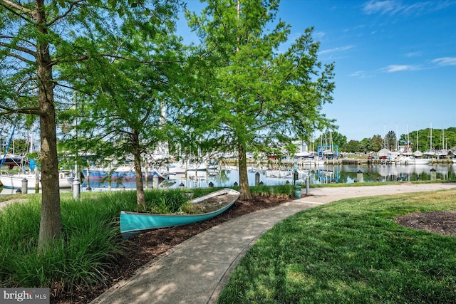 418 S Seaway Ct, Cambridge, MD 21613 - view of property's community featuring a water view, a dock, and a lawn